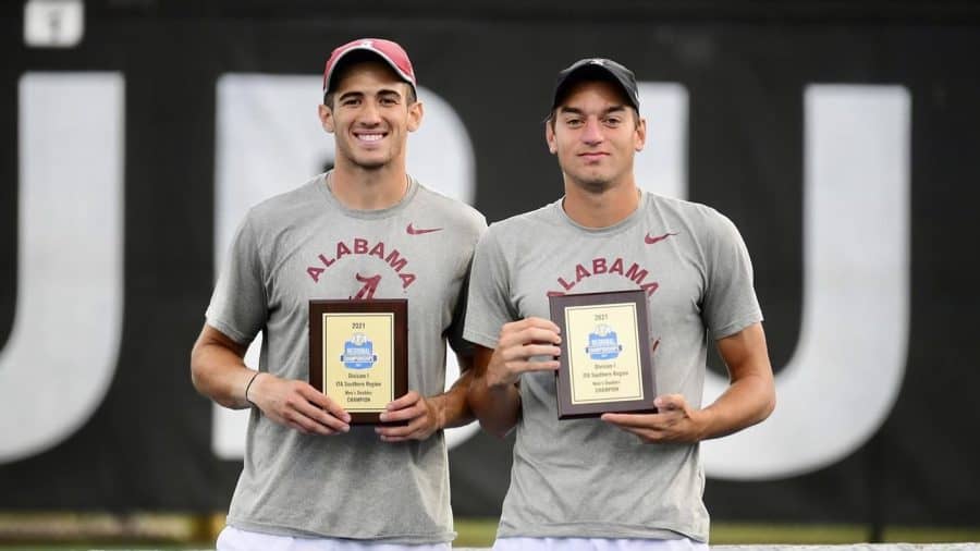 Doubles partners Filip Planinsek and Juan Martin pose with their award plaques.