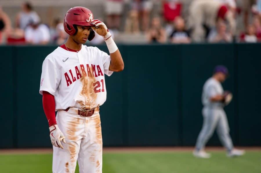 Alabama right fielder Andrew Pinckney (21) looks on from the basepath in the Crimson Tides 6-5 loss to the No. 20 LSU Tigers on April 6 at Sewell-Thomas Stadium in Tuscaloosa, Alabama.
