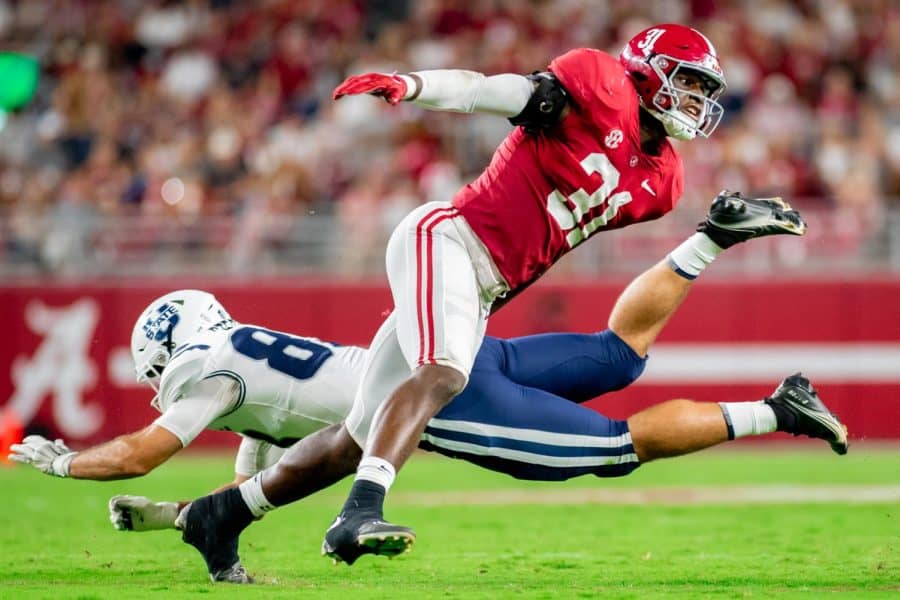 Alabama linebacker Will Anderson Jr. (31) throws down a Utah State lineman on his way to the quarterback versus the Utah State Aggies on Sept. 3 at Bryant-Denny Stadium in Tuscaloosa, Ala.