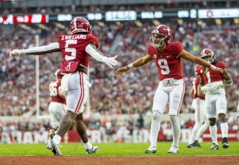 Alabama quarterback Bryce Young congratulates running back Roydell Williams (5) after a touchdown in the Crimson Tides 49-27 win over the Auburn Tigers on Nov. 26 at Bryant-Denny Stadium in Tuscaloosa, Ala.