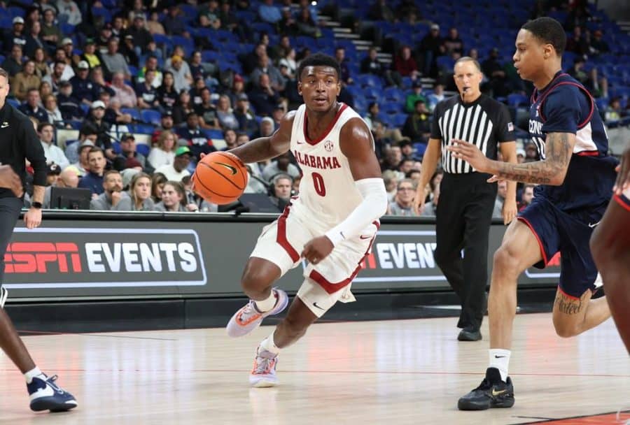 Alabama guard Jaden Bradley (0) looks to get to the basket in the Crimson Tide’s 82-67 loss to the UConn Huskies on Nov. 25 at Veterans Memorial Coliseum in Portland, Ore.