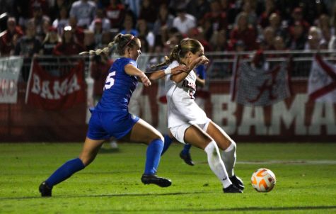 Alabama soccer player Felicia Knox (#8) protects the ball in a match against the University of Florida in Tuscaloosa, Ala. 