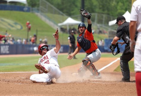 Alabama baseball player Tommy Seidl (#20) slides into home against Auburn on May 25 at Hoover Met in Birmingham, Ala. (Courtesy of UA Athletics)