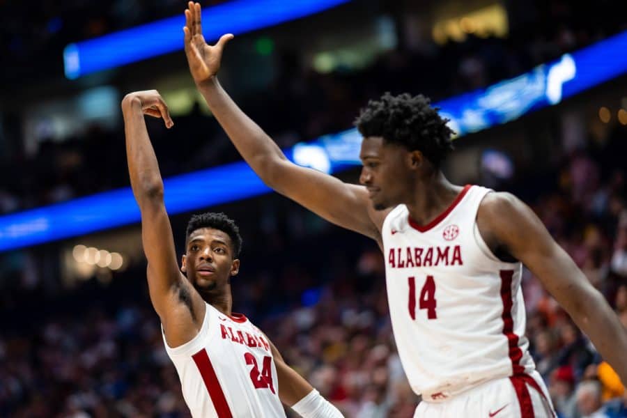 Former Alabama basketball players Brandon Miller (#24) and Charles Bediako (#14) celebrating a score against Mississippi State on March 10 at the Bridgestone Arena in Nashville, TN.