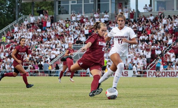 Alabama soccer player Felicia Knox (#8) kicking the ball in a game against Arkansas on Sep. 21 at Razorback Field in Fayetteville, AR.