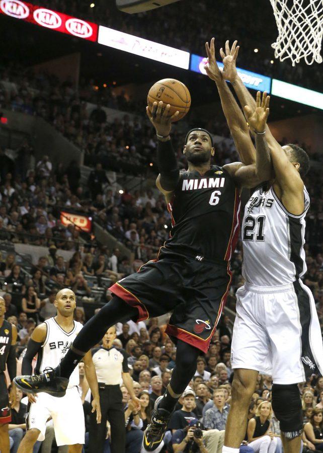 LeBron James keeps Heat, sports fans guessing about future