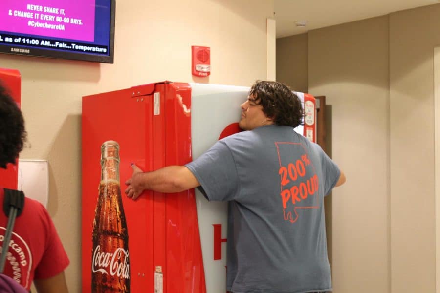 Vending machines in Ferg output Coke after hug