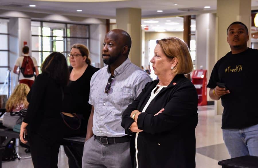 BFSA President André Denham (middle) observes a student die-in next to interim VP of Student Life Kathleen Cramer (right). CW / Hannah Saad