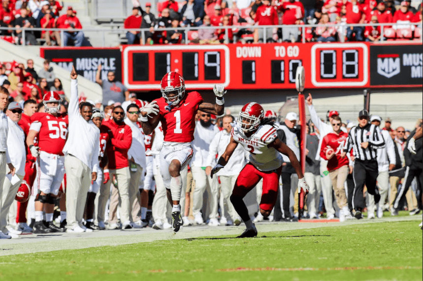 Wide receiver Jameson Williams tiptoes down the sideline on a big play against New Mexico State on Saturday. 