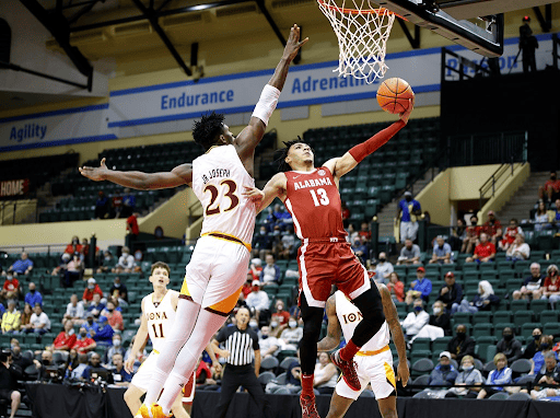 Guard Jahvon Quinerly attempts a layup during the quarterfinal of the ESPN Events Invitational against the Iona Gaels on Nov. 25, 2021.