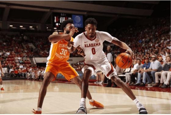 Forward Noah Gurley muscles past a Tennessee defender during Tuesday's game. 