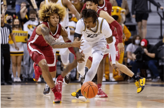 Missouri’s DaJuan Gordon and Alabama’s JD Davison fight for a loose ball in Alabama’s 92-86 loss at Mizzou Arena in Columbia, MO.