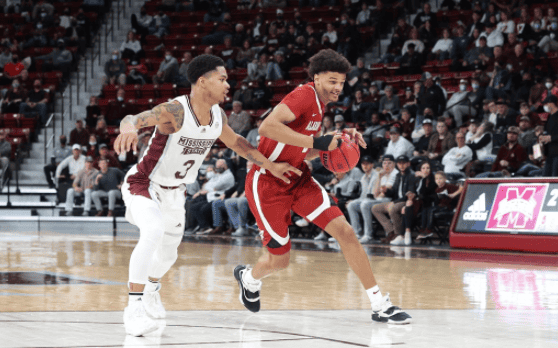 Guard Darius Miles (2) drives past guard Shakeel Moore (3) in Alabama’s 78-76 loss against Mississippi State in Starkville, Mississippi. 