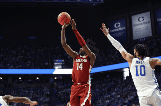 Alabama guard Keon Ellis (14) shoots over Kentucky’s Davion Mintz (10) in the Crimson Tide’s 90-81 loss at Rupp Arena in Lexington, Kentucky, on Feb. 19, 2022. 