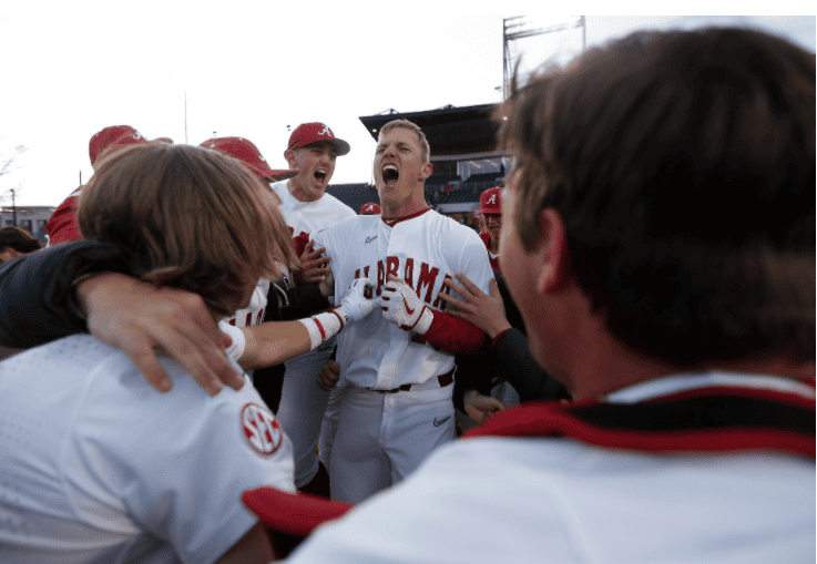 Alabama junior Owen Diodati celebrates with his teammates after a walk-off victory against the Xavier Musketeers on Feb. 18, 2022. 