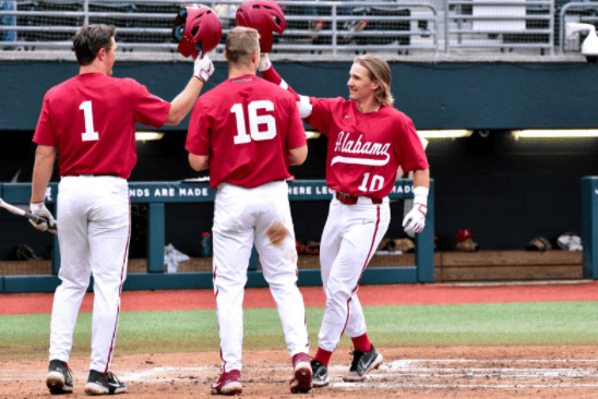 Alabama shortstop Jim Jarvis (10) celebrates with Owen Diodati (16) and Will Hodo (1) after hitting a home run against Alabama State on Feb. 23. 