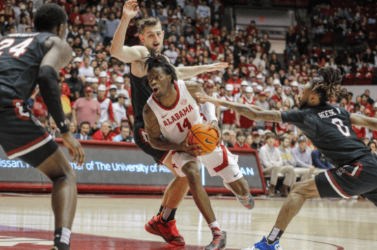 Alabama guard Keon Ellis (14) drives into the paint in the Crimson Tide’s 90-71 win over the Gamecocks at Coleman Coliseum on Feb. 26. 