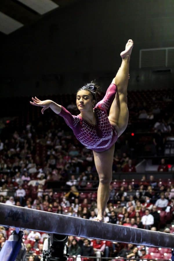 Junior Luisa Blanco performs her beam routine.