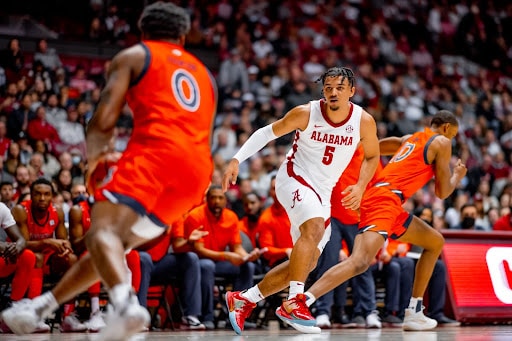 Alabama’s Jaden Shackelford (5) focuses on Auburn’s K.D. Johnson (0) during the Tigers’ 81-77 win in Coleman Coliseum on Jan. 11, 2022. 