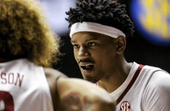 Alabama forward Noah Gurley (0) and guard JD Davison (3) talk during the Crimson Tide’s 80-75 win over Mississippi State on Feb. 16.