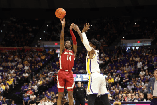 Alabama guard Keon Ellis (14) shoots a 3-pointer over LSU forward Mwani Wilkinson (5) in the Crimson Tide’s 80-77 loss at the Pete Maravich Assembly Center on March 5.