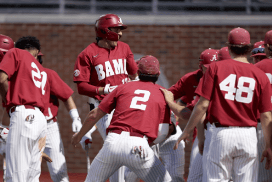 Alabama second baseman Bryce Eblin (13) celebrates with teammates after hitting a home run in the Crimson Tide’s 5-4 victory over South Alabama on March 29 at Sewell-Thomas Stadium in Tuscaloosa, Alabama.