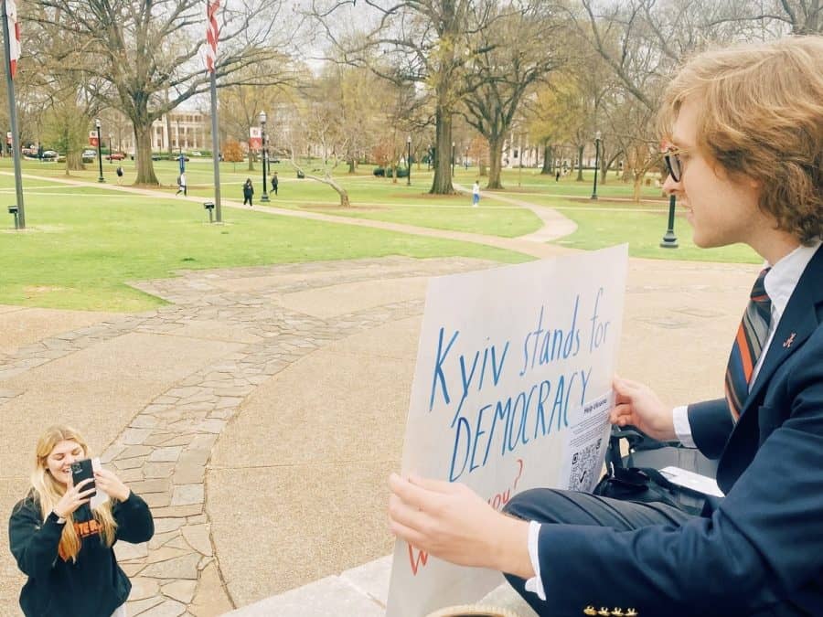 UA student Jackson Hannan protests the invasion of Ukraine on the steps of Gorgas Library. 