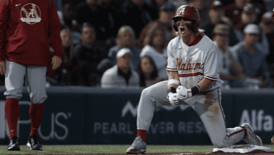 Alabama shortstop Jim Jarvis (11) shows excitement in the Crimson Tide’s 7-4 win over the No. 9 Ole Miss Rebels on April 8 at Swayze Field in Oxford, Mississippi.