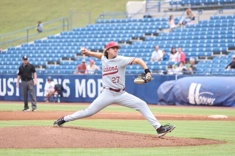(11) Alabama pitcher Ben Hess (27) throws a pitch in the Crimson Tide’s 5-3 victory over the (6) Georgia Bulldogs on May 24 at Hoover Metropolitan Stadium in Hoover, Alabama.