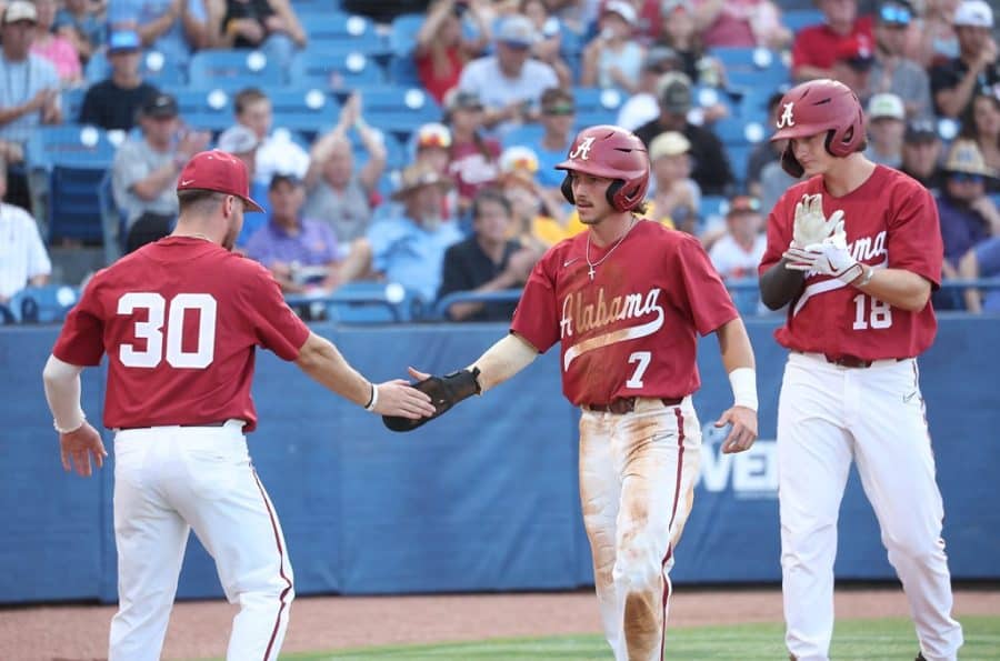 Jake+Leger+%2830%29+and+Drew+Williamson+%2818%29+congratulate+Alabama+center+fielder+Caden+Rose+%287%29+on+his+way+back+to+the+dugout+in+the+Crimson+Tides+12-8+loss+to+the+No.+2+Texas+A%26M+Aggies+on+May+27+at+Hoover+Metropolitan+Stadium+in+Hoover%2C+Alabama.