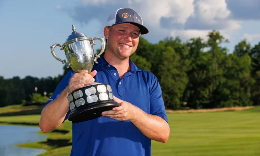 Former Alabama mens golfer and current PGA golfer Trey Mullinax poses with the 2022 Barbasol Championship trophy on July 10 at Keene Trace Golf Club in Nicholasville, Kentucky.