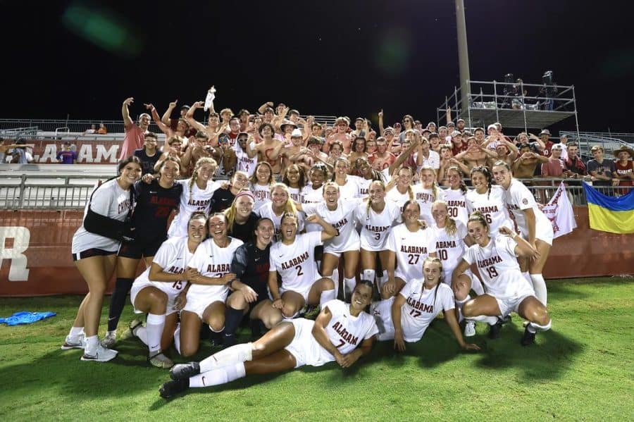The Alabama soccer team celebrates with their fans following the Crimson Tides 3-0 win over the No. 18 Clemson Tigers on Aug. 28 at the Alabama Soccer Stadium in Tuscaloosa, Ala.