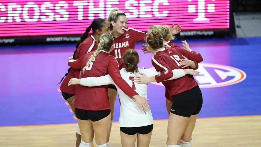 Alabama volleyball players gather together after a point in the Crimson Tide's loss to the No. 12 Florida Gators on Sept. 21 at Exactech Arena in Gainesville, Fla.