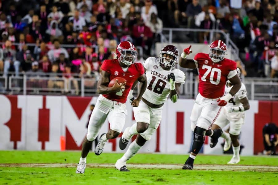 Alabama quarterback Jalen Milroe (4) runs down the field in the Crimson Tides 24-20 win over the Texas A&M Aggies on Oct. 8 at Bryant-Denny Stadium in Tuscaloosa, Ala.