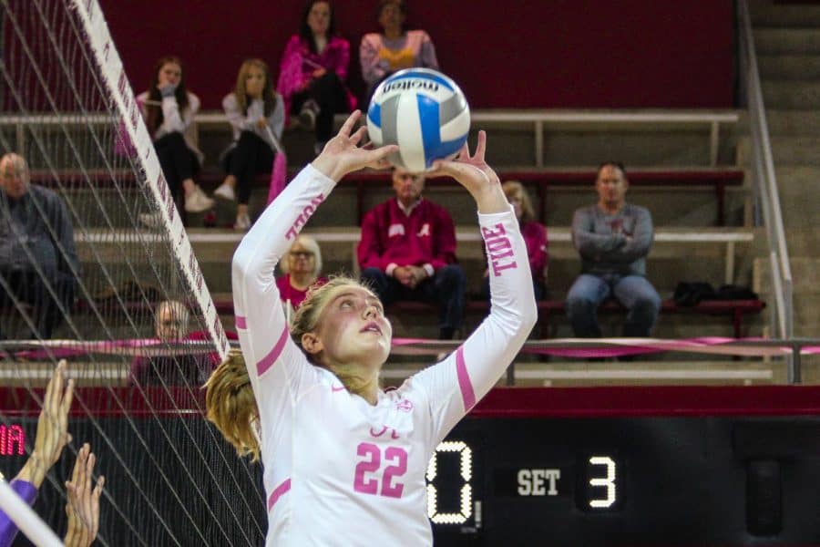 Setter Emily Janek (22) sets the ball in the Crimson Tide’s pink out game against LSU on Oct. 20 at Foster Auditorium in Tuscaloosa, Ala.