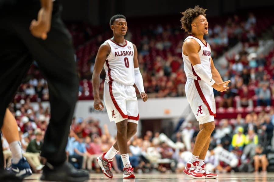 Alabama guards Jaden Bradley (0) and Mark Sears (1) fire up the crowd in the Crimson Tides 95-59 win over the Liberty Flames on Nov. 11 at Coleman Coliseum in Tuscaloosa, Ala.