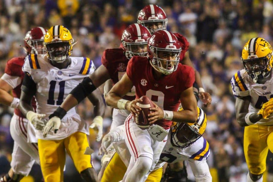 Alabama quarterback Bryce Young (9) looks to escape pressure in the Crimson Tide’s 32-31 overtime loss to the No. 10 LSU Tigers on Nov. 5 at Tiger Stadium in Baton Rouge, La.
