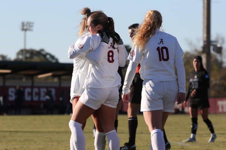 Alabama midfielder Felicia Knox (8) is hugged by Ashlynn Serepca (19) in the Crimson Tides 3-1 win over the UC Irvine Anteaters in the Sweet 16 of the NCAA Tournament on Nov. 20 at the Alabama Soccer Stadium in Tuscaloosa, Ala.