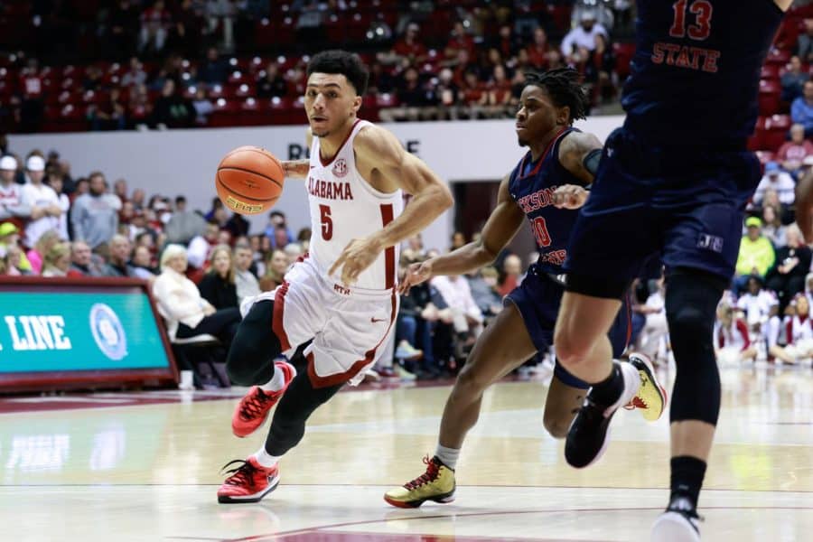 Jahvon Quinerly (5) drives to the basket in Alabamas win over Jackson State.