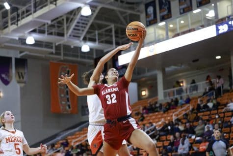 Alabamas Aaliyah Nye (32) drives to the basket in the Crimson Tides 88-52 victory over the Mercer Bears on Nov. 30 at Hawkins Arena in Macon, Ga.