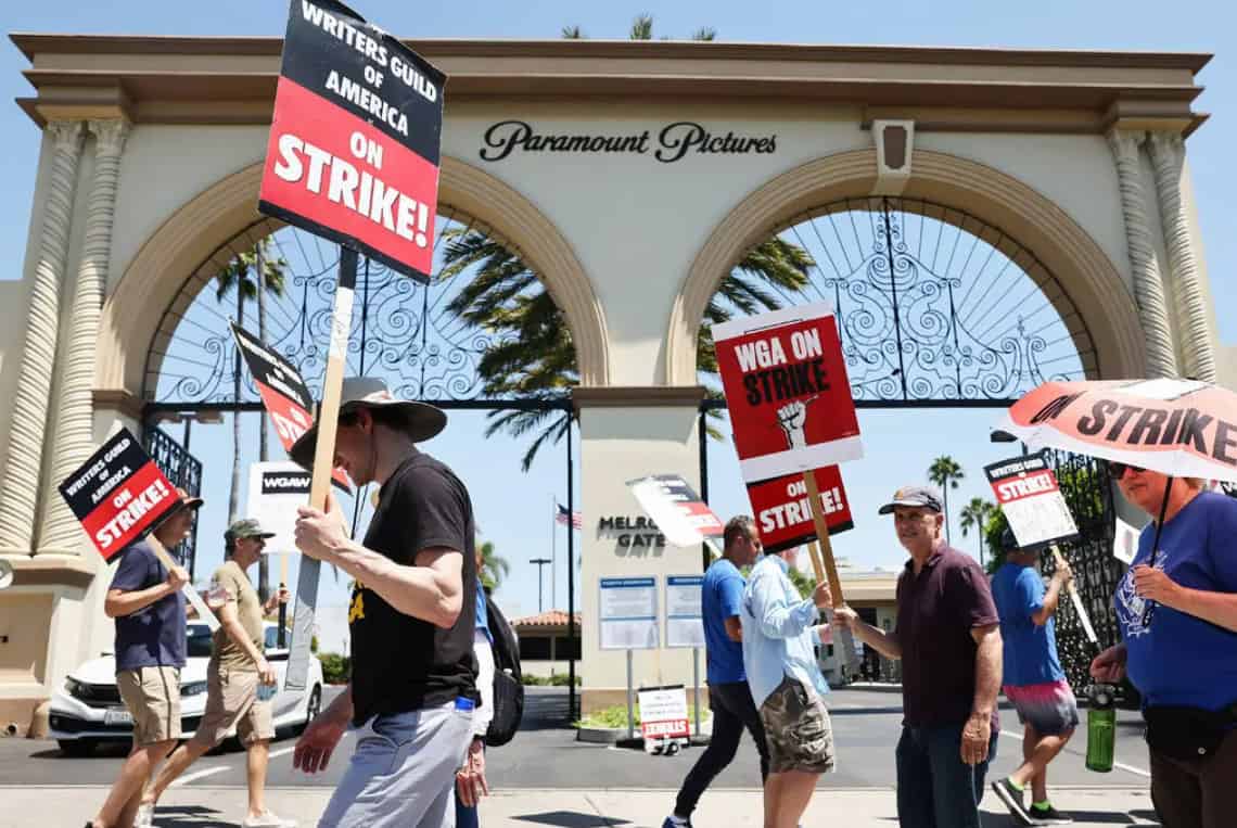 Writers and actors picket outside Paramount Pictures Studios in Los Angeles, CA.
