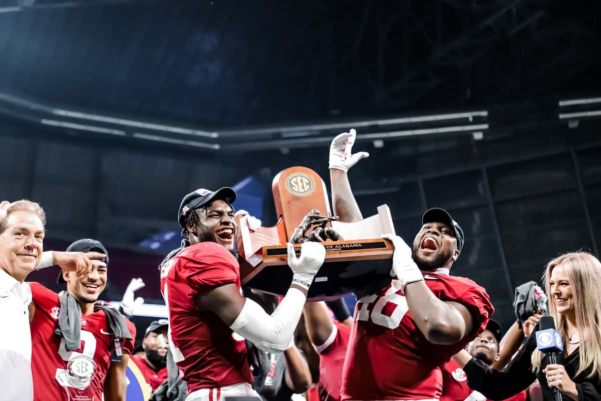 The Alabama football team celebrates their win over Georgia at the SEC Championship game on Dec. 4, 2021 at Mercedes-Benz Stadium in Atlanta, GA. 