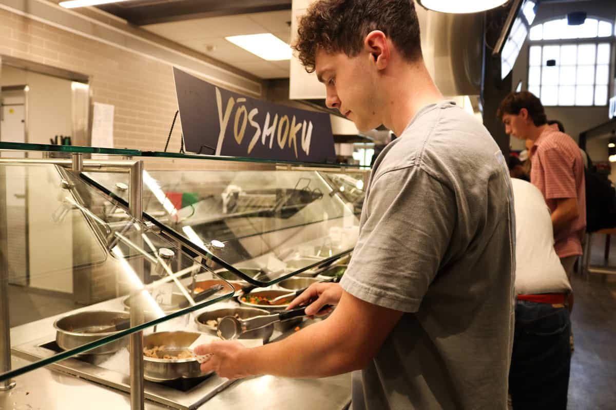 Student gets a meal at Lakeside Dining Hall.