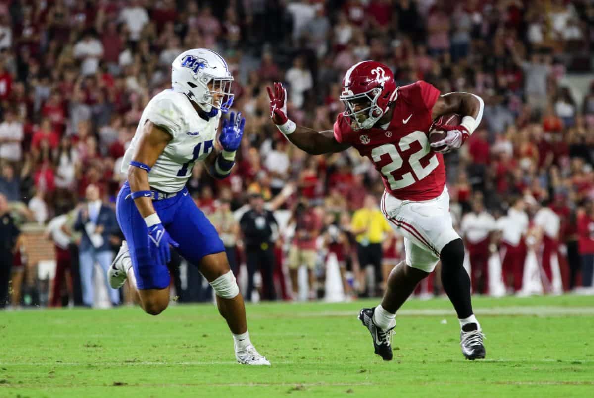 Alabama running back Justice Haynes (#22) attempts a stiff arm in a game against Middle Tennessee on Sept. 2 at Bryant-Denny Stadium in Tuscaloosa, Ala.