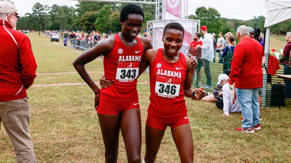  Doris Lemngole (left) and Hilda Olemomoi (right) after crossing the line in first and second place.
