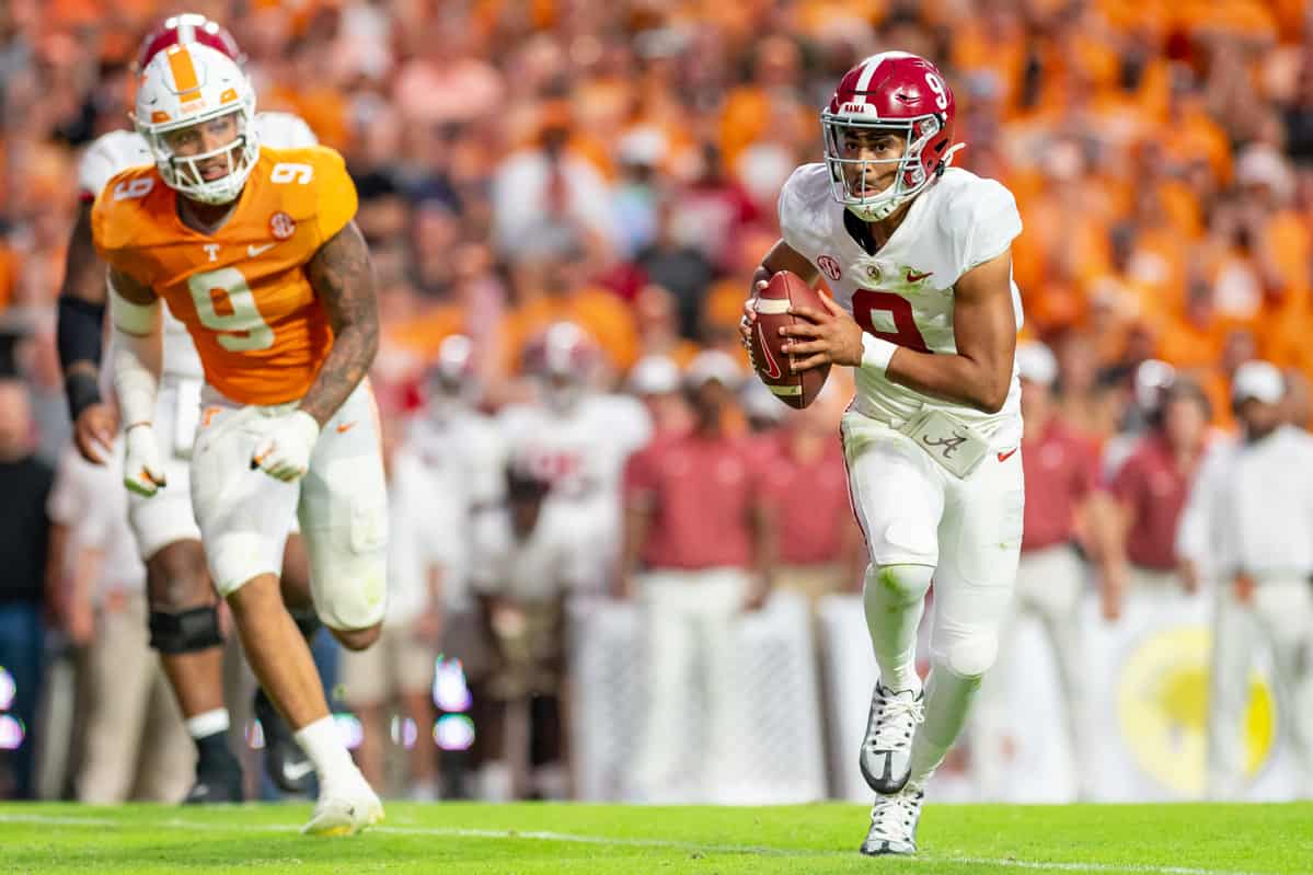 Former Alabama quarterback Bryce Young (#9) runs from the Tennessee defense in 2022.