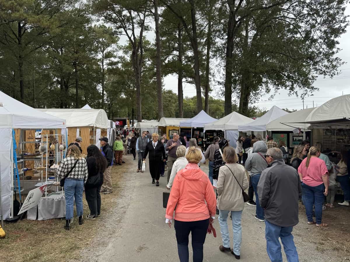 Visitors walk the paths of the Kentuck Art Festival.