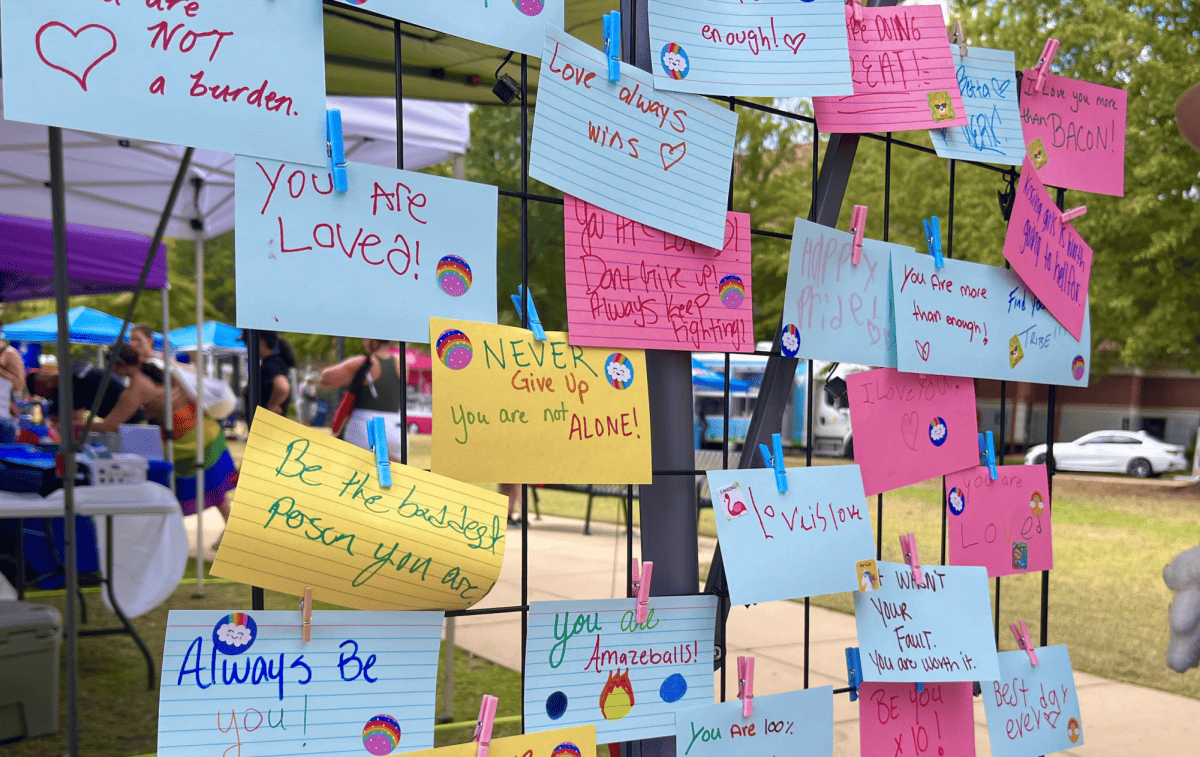 Festival attendees leave behind words of encouragement to members of the LGBTQ+ community on Oct. 1 at Druid City Pride Festival.
