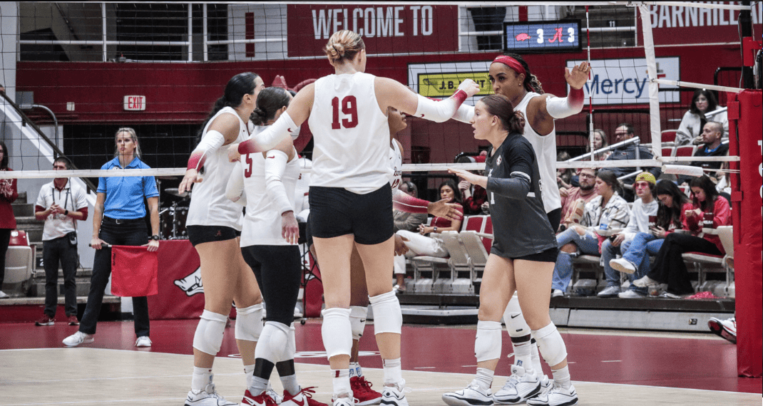 Alabama volleyball comes together after a point in its game against Arkansas on Oct. 15 in Fayetteville, Arkansas.