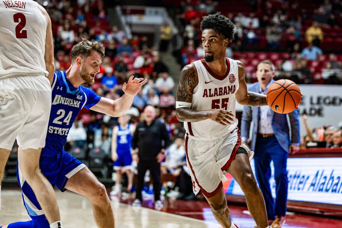 Alabama basketball player Aaron Estrada (#55) dribbles the ball down the court against Indiana State on Nov. 10 in Tuscaloosa, Ala.